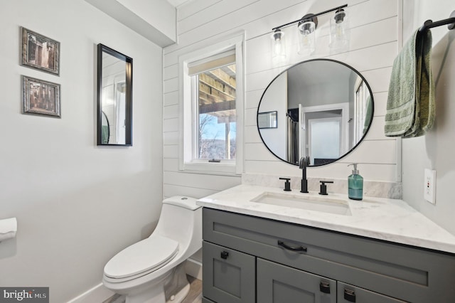 bathroom featuring toilet and vanity