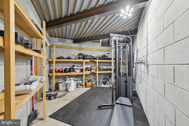 workout room with concrete block wall