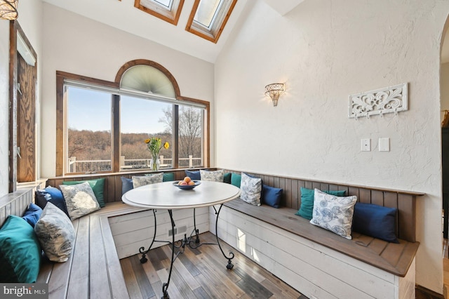 interior space with visible vents and lofted ceiling with skylight