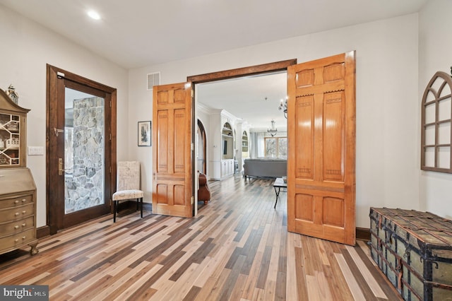 interior space featuring light wood-type flooring and visible vents