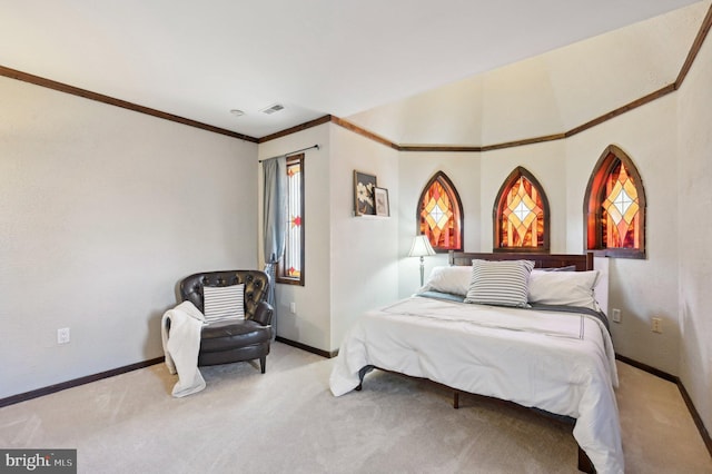 bedroom featuring visible vents, carpet floors, baseboards, and ornamental molding