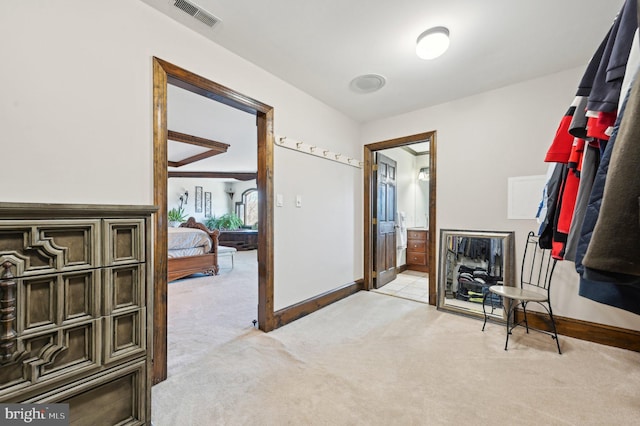 interior space with light carpet and visible vents