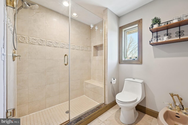 full bath with tile patterned floors, a stall shower, a bidet, and baseboards