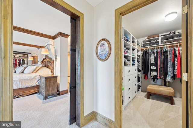 walk in closet featuring carpet flooring