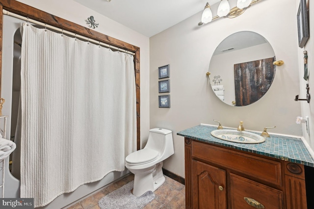 bathroom with shower / bath combination with curtain, toilet, vanity, and baseboards