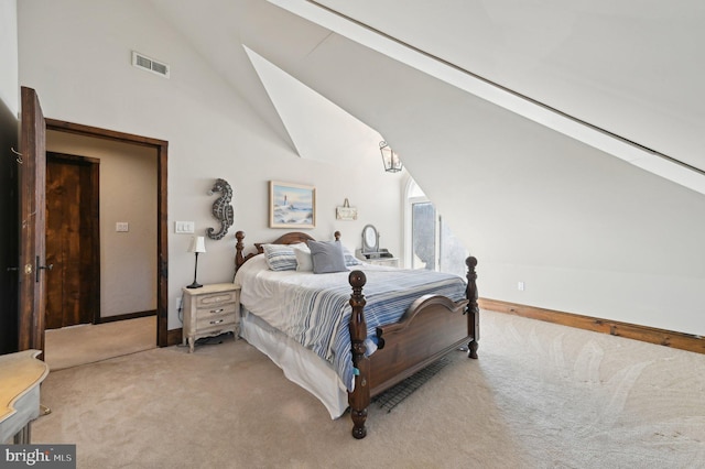 carpeted bedroom featuring baseboards, visible vents, and high vaulted ceiling