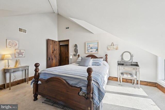 bedroom featuring vaulted ceiling, visible vents, baseboards, and carpet floors