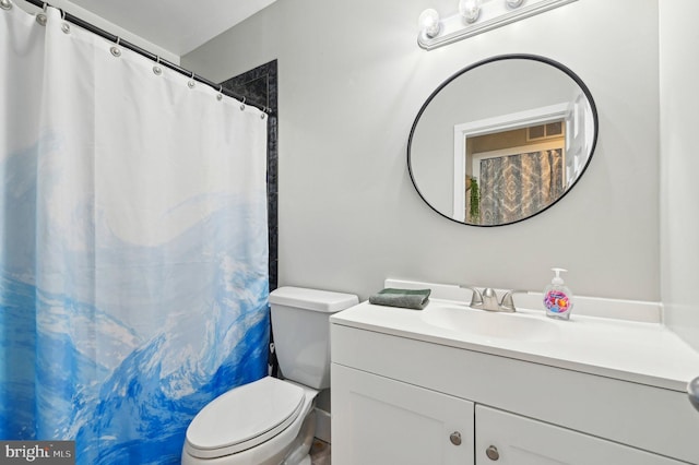 full bath featuring vanity, toilet, and visible vents