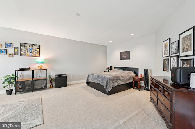 bedroom with recessed lighting, light colored carpet, and baseboards