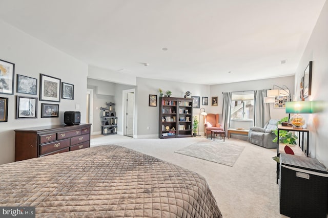 carpeted bedroom featuring baseboards