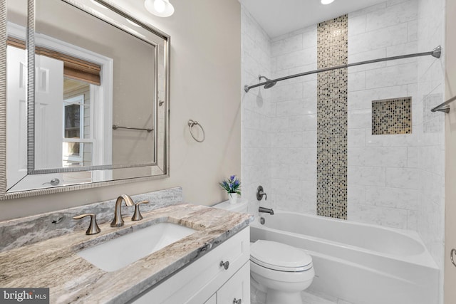 bathroom featuring shower / bathtub combination, vanity, and toilet