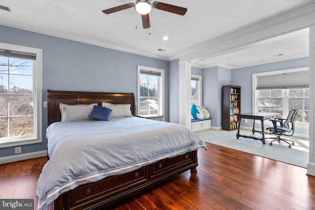 bedroom with recessed lighting, wood finished floors, visible vents, baseboards, and crown molding