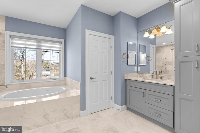 full bath featuring a garden tub, vanity, baseboards, marble finish floor, and walk in shower