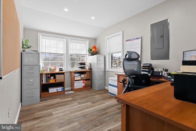 home office with electric panel, baseboards, lofted ceiling, wood finished floors, and recessed lighting