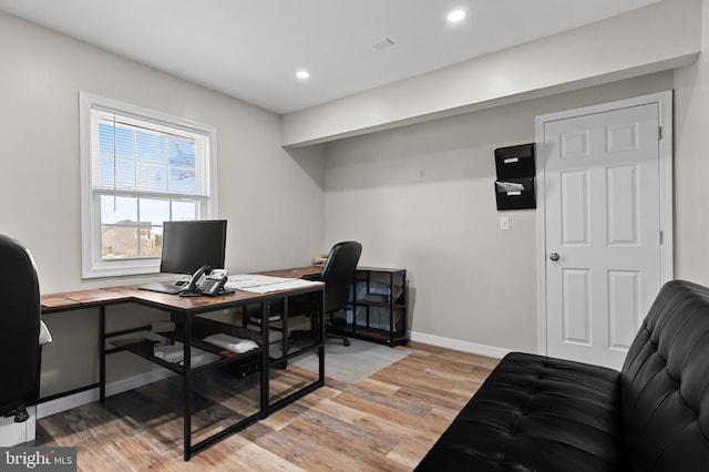 office area with recessed lighting, light wood-style flooring, and baseboards