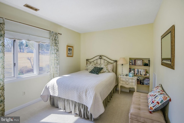 bedroom featuring carpet floors, baseboards, and visible vents