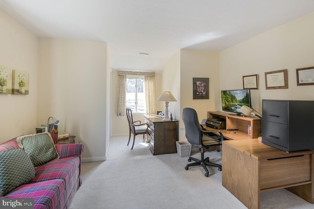 carpeted office space with visible vents and baseboards