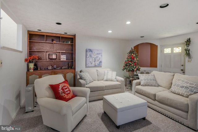 living room with carpet and recessed lighting