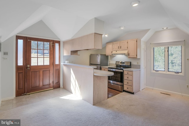 kitchen featuring stainless steel appliances, light countertops, light colored carpet, light brown cabinetry, and under cabinet range hood