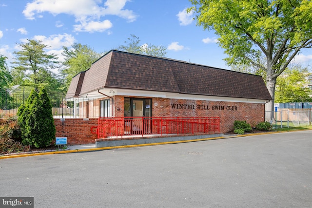 view of building exterior featuring fence