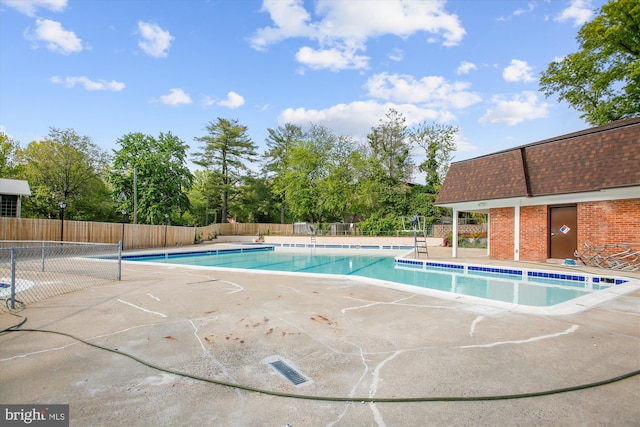 community pool featuring fence