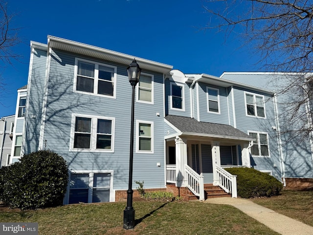 view of property featuring a front yard