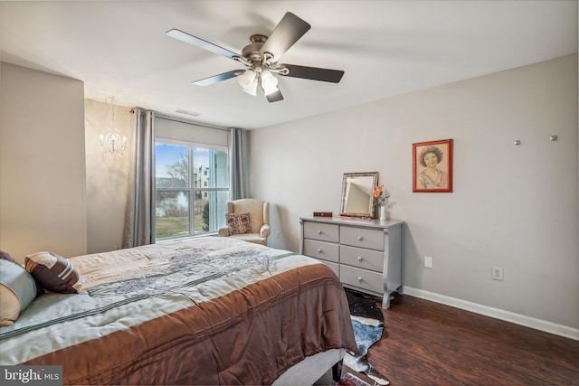 bedroom featuring ceiling fan, visible vents, baseboards, and dark wood-type flooring