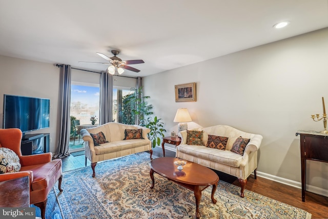 living room featuring ceiling fan, recessed lighting, wood finished floors, and baseboards