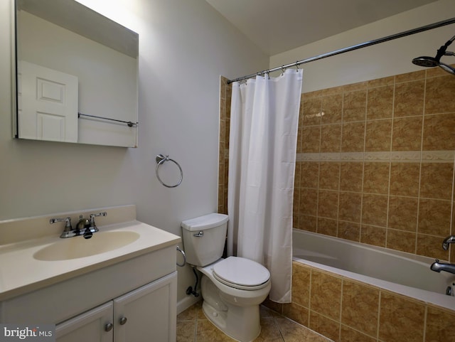 bathroom featuring tiled shower / bath combo, tile patterned flooring, toilet, and vanity