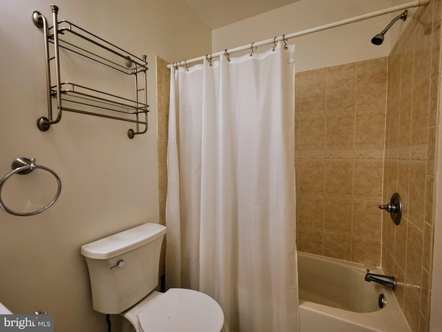 bathroom featuring toilet and shower / bath combination with curtain