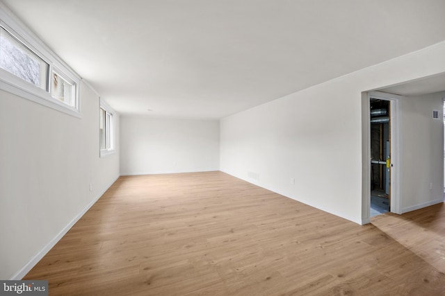 interior space with light wood-style floors and visible vents