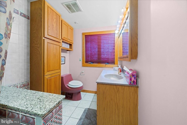 full bath with baseboards, visible vents, toilet, tile patterned floors, and vanity