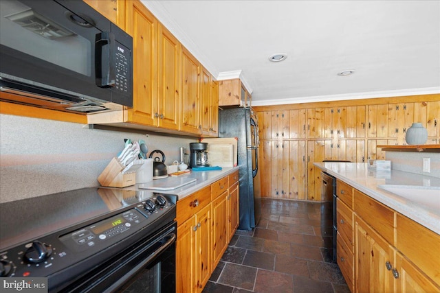 kitchen featuring brown cabinets, stone tile floors, light countertops, ornamental molding, and black appliances