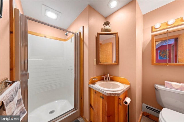 full bath featuring a stall shower, toilet, vanity, and baseboard heating