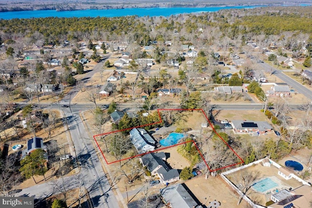 birds eye view of property featuring a water view and a residential view