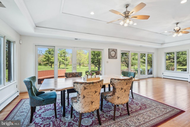 sunroom / solarium featuring a baseboard radiator and visible vents