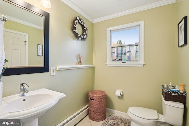 half bathroom with a sink, a baseboard heating unit, ornamental molding, and toilet
