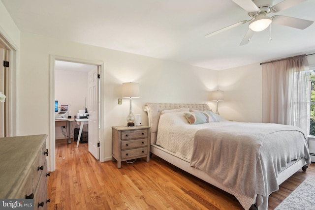 bedroom featuring a ceiling fan and light wood-style floors