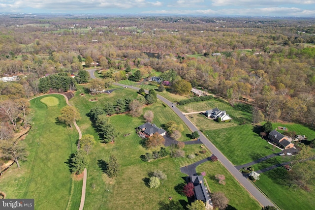 drone / aerial view featuring a forest view