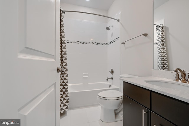 bathroom featuring toilet, shower / bathtub combination, tile patterned flooring, and vanity