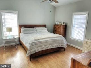 bedroom featuring light wood-type flooring, ceiling fan, and baseboards