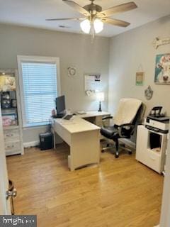 office area with light wood finished floors and a ceiling fan