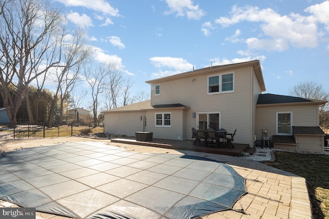 rear view of house featuring a patio area and fence