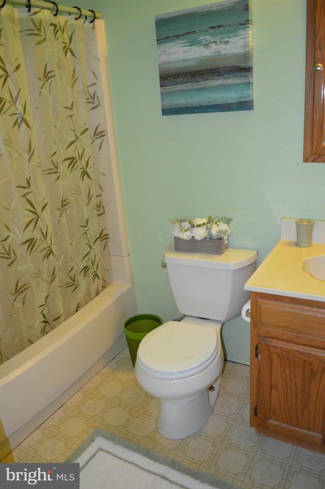 full bathroom with toilet, shower / tub combo with curtain, vanity, and tile patterned floors