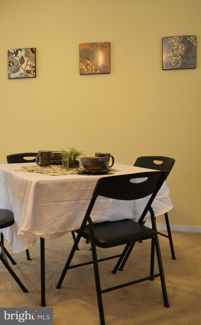 dining space with baseboards