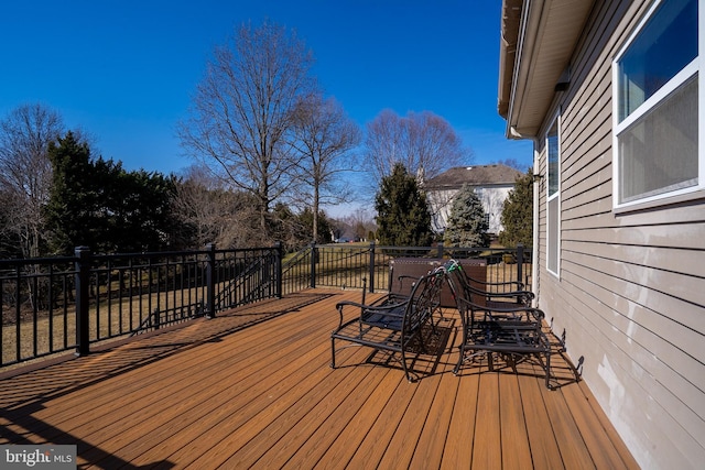 wooden deck with outdoor dining area