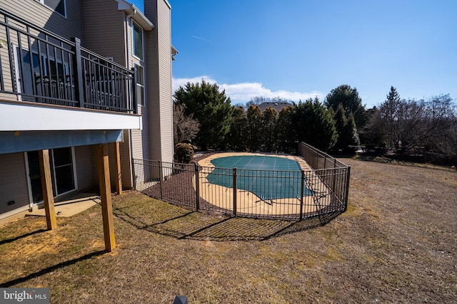 view of pool featuring a fenced in pool, a yard, fence, and a patio