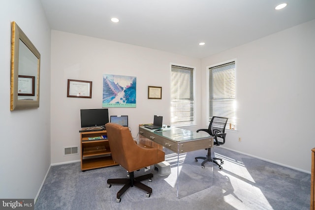 carpeted office space with baseboards, visible vents, and recessed lighting