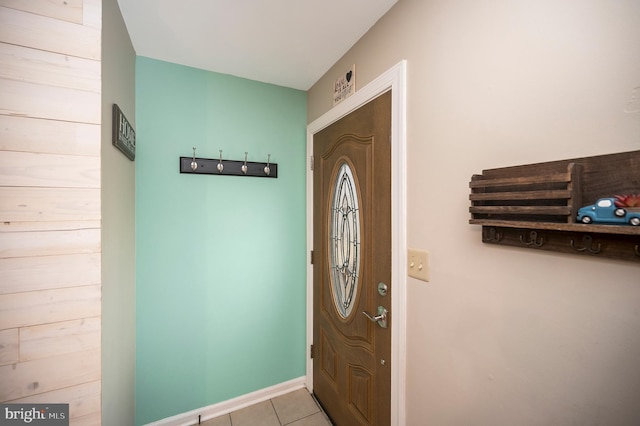 entrance foyer featuring tile patterned flooring and baseboards