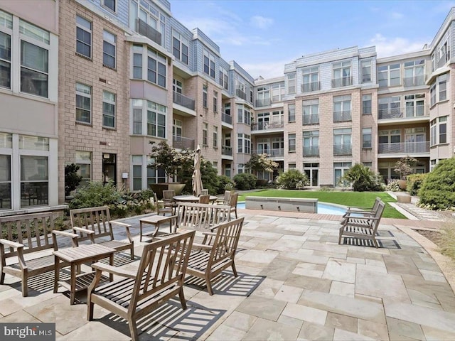 view of home's community featuring a patio area